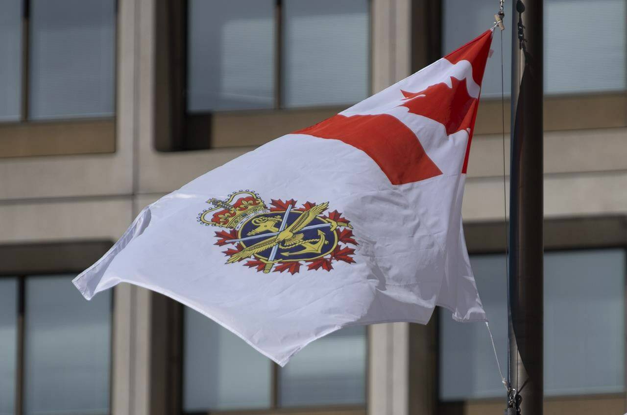 The Canadian Forces flag flies outside office buildings in Ottawa, Tuesday March 9, 2021. An expert on sexual misconduct in the military says it would be dishonest for the Department of National Defence to promote the military as a positive place for women to work in an upcoming campaign after widespread reports to the contrary. THE CANADIAN PRESS/Adrian Wyld