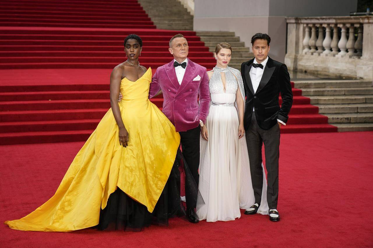Lashana Lynch, from left, Daniel Craig, Lea Seydoux and Cary Joji Fukunaga pose for photographers upon arrival for the World premiere of the new film from the James Bond franchise ‘No Time To Die’, in London Tuesday, Sept. 28, 2021. (AP Photo/Matt Dunham)