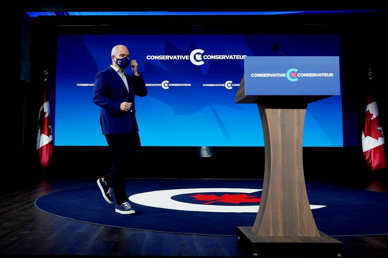 Conservative Leader Erin O’Toole walks on stage as he prepares to speak in Ottawa on Tuesday, September 21, 2021. THE CANADIAN PRESS/Adrian Wyld