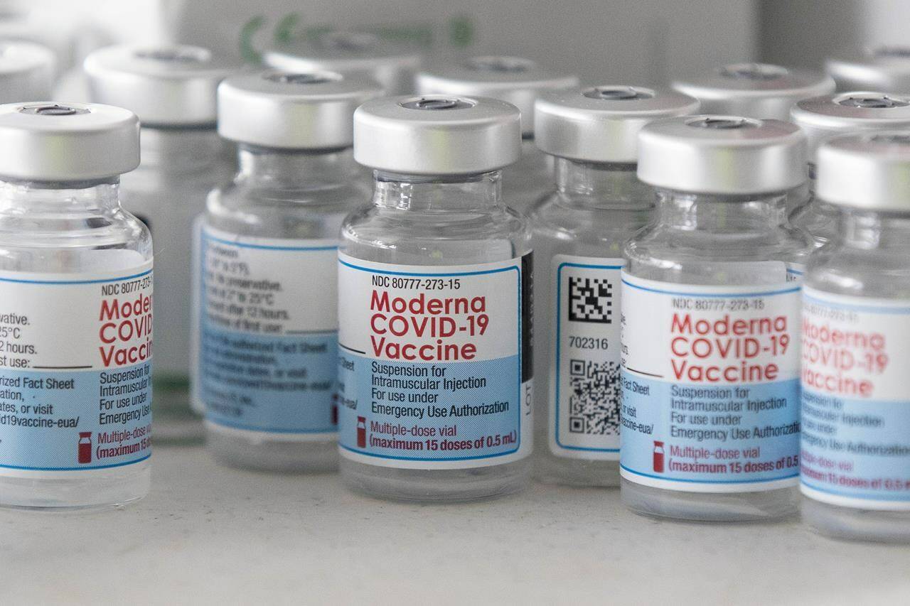 Empty Moderna vaccine vials are shown before a COVID-19 vaccine drive-thru clinic at Richardson stadium in Kingston, Ont., on Friday, Jul. 2, 2021. THE CANADIAN PRESS/Lars Hagberg