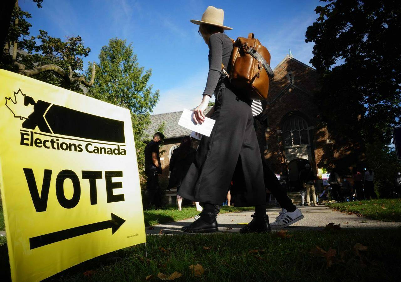 People start to line up early for the Canadian general election before polls open in west-end Toronto for the Monday, Sept. 20, 2021 election. The NDP has requested an official inquiry into what it calls “numerous and systemic failures of election officials” on election day. THE CANADIAN PRESS/Graeme Roy