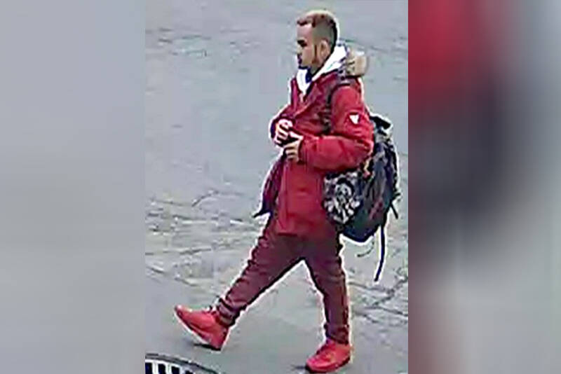 The suspect, seen here on security footage obtained by Vancouver Police is an Asian man in his 20s, with a small build and short, dark hair. He was wearing a red ski jacket, a white hoodie, red pleather pants, and Air Force 1 basketball shoes. He also had a black and red camouflage backpack. (VPD photo)