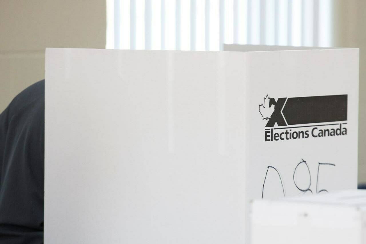 A man casts his ballot at a polling station on federal election day in Shawinigan, Que., Monday, Oct. 21, 2019. THE CANADIAN PRESS/Graham Hughes