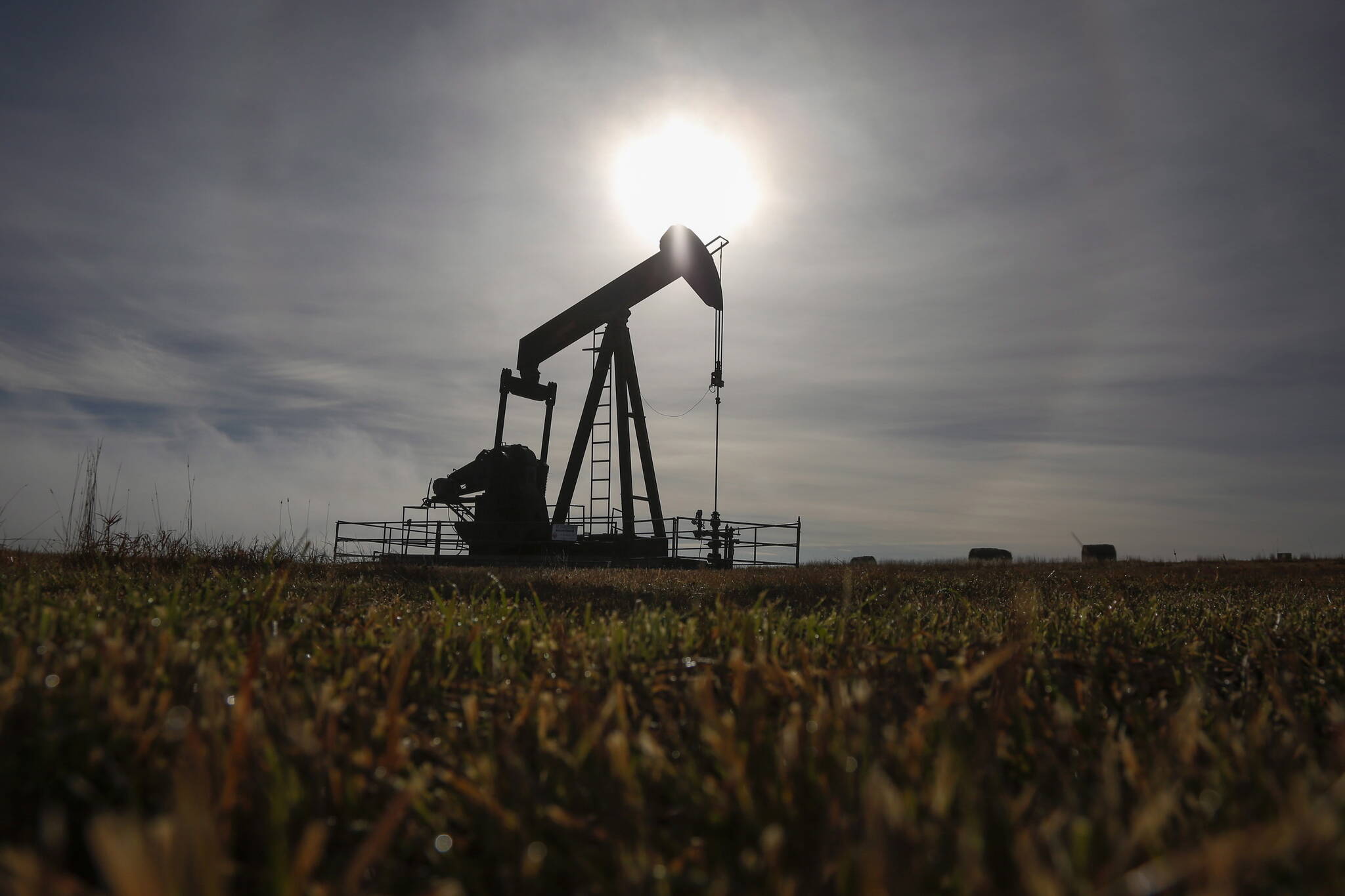 A pumpjack works at a well head on an oil and gas installation near Cremona, Alta., Saturday, Oct. 29, 2016. The Alberta Orphan Well Association says it has taken the "unprecedented" step of having a receiver appointed to manage the oil and gas assets of failed Trident Exploration. THE CANADIAN PRESS/Jeff McIntosh