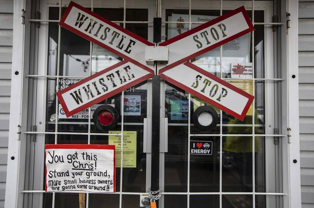 A message of support on the closed front door of the Whistle Stop Café during a rally against measures taken by government and health authorities to curb the spread of COVID-19 in Mirror, Alberta on Saturday May 8, 2021. Christopher Scott, owner of the Whistle Stop Café in the hamlet of Mirror, northeast of Red Deer, will pay $20,000 in fines and get 18 months probation. THE CANADIAN PRESS/Jason Franson