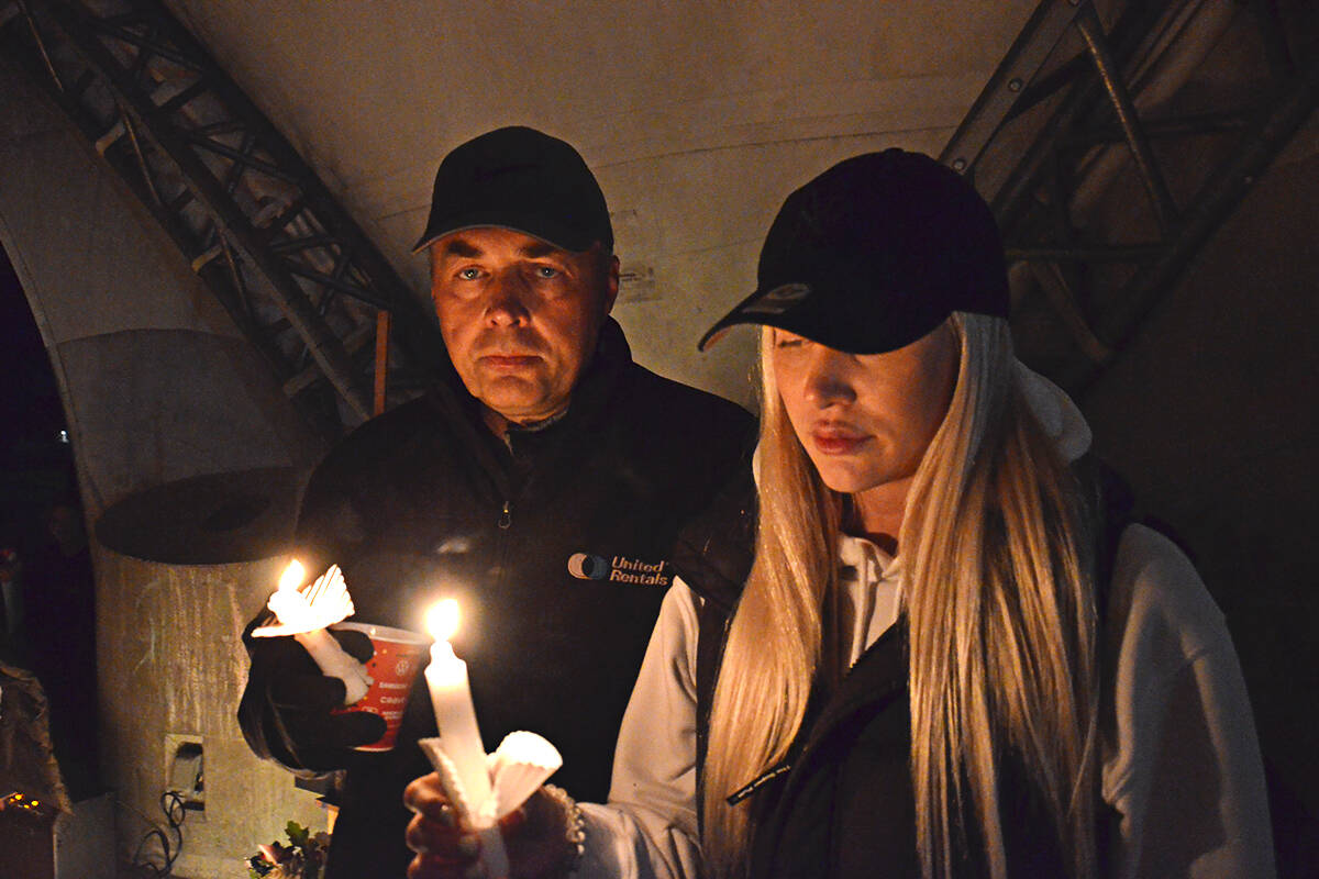 Nick Goodrick and his daughter, Nikki, at a candlelight vigil held for Devon Goodrick at Douglas Park in Langley City on Oct. 7, 2021. (Langley Advance Times file)