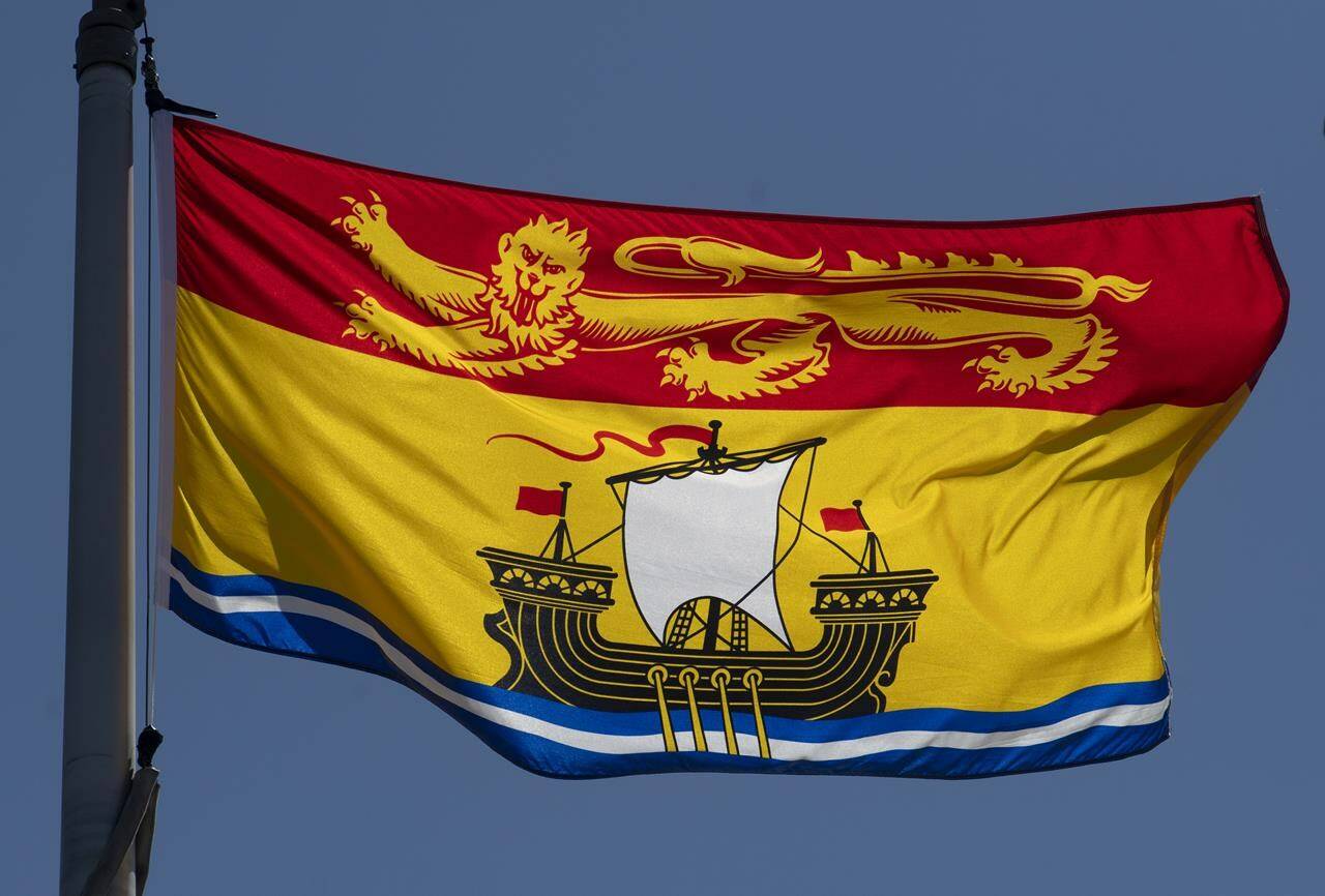 New Brunswick’s provincial flag flies in Ottawa, Monday, July 6, 2020. Government employees in New Brunswick have been ordered to stop making territorial or title acknowledgements in reference to First Nations lands. THE CANADIAN PRESS/Adrian Wyld