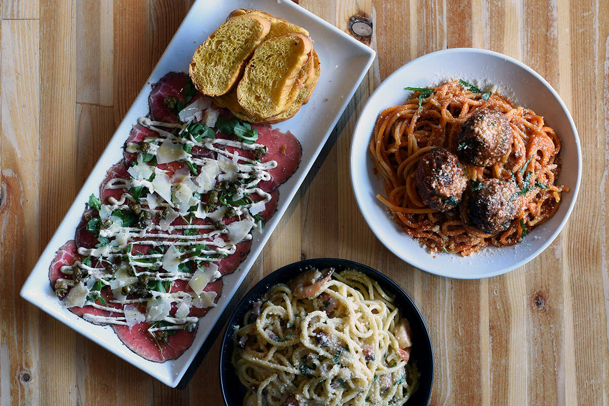 September 8, 2021 -Dishes of ( from top left, clockwise) Beef Carpaccio, Spaghetti and Wagyu Meatballs  and Prawn Carbonara at the Lot 1 Pasta Bar restaurant. Don Denton photograph