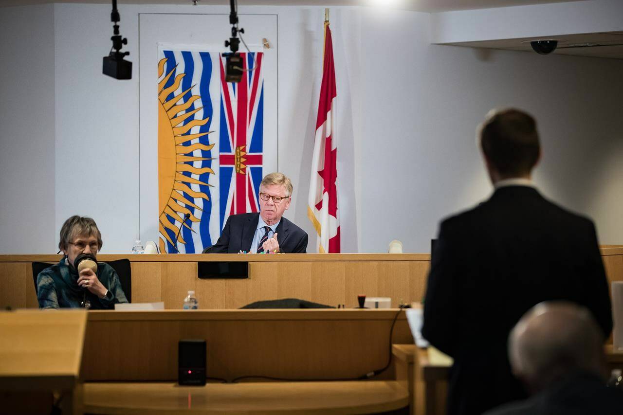 Commissioner Austin Cullen, back centre, listens to introductions before opening statements at the Cullen Commission of Inquiry into Money Laundering in British Columbia in Vancouver on Monday, February 24, 2020. THE CANADIAN PRESS/Darryl Dyck
