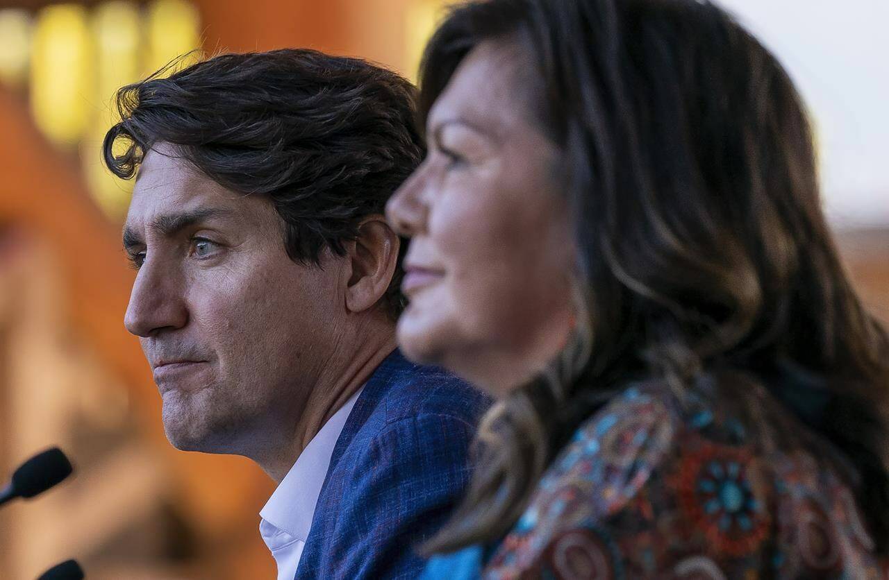 Prime Minister Justin Trudeau pauses for a moment as he listens to Chief Rosanne Casimir as she speaks in Kamloops, B.C., Monday, Oct. 18, 2021. Senior members of a British Columbia First Nation have issued an open letter to Trudeau, offering seven immediate steps he could take to prove he is serious about reconciliation. THE CANADIAN PRESS/Jonathan Hayward