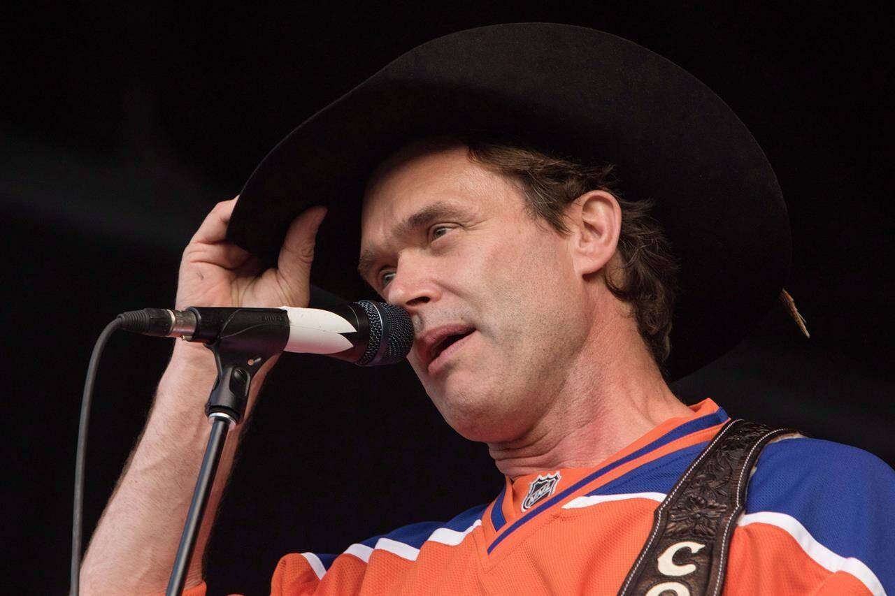 Corb Lund tips his hat during Fire Aid for Fort McMurray concert in Edmonton on Wednesday, June 29, 2016. THE CANADIAN PRESS/Amber Bracken
