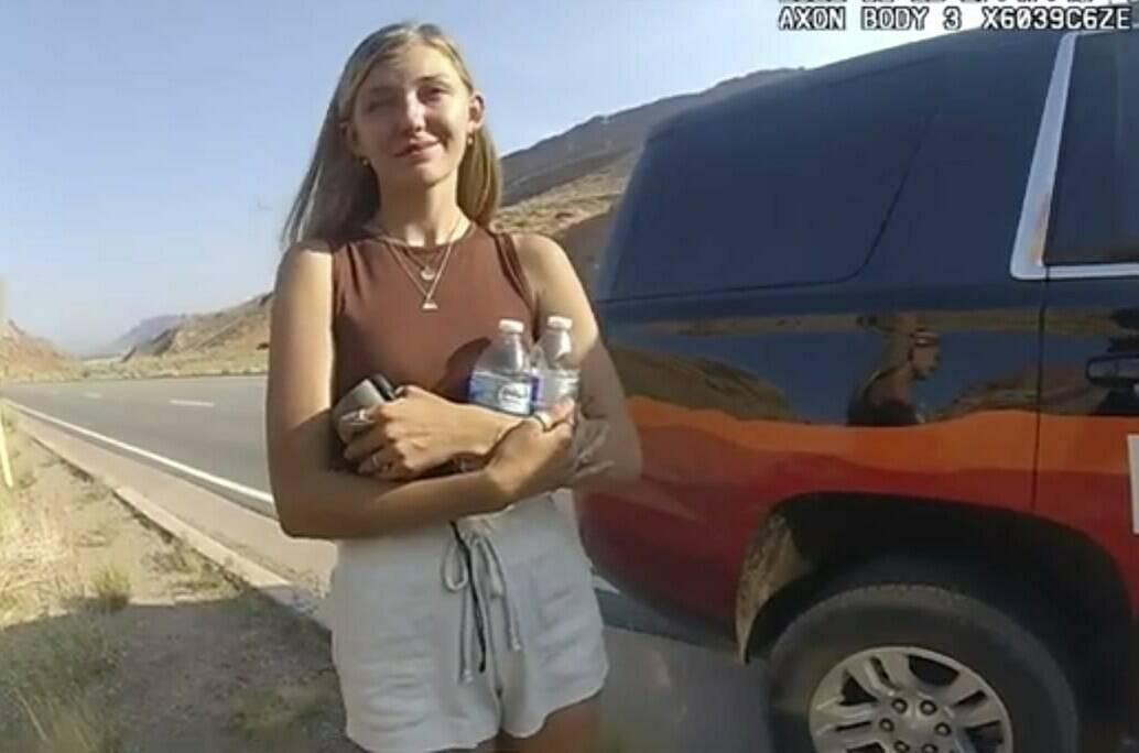 FILE - This police camera video provided by The Moab Police Department shows Gabrielle “Gabby” Petito talking to a police officer after police pulled over the van she was traveling in with her boyfriend, Brian Laundrie, near the entrance to Arches National Park on Aug. 12, 2021. Teton County Coroner Brent Blue is scheduled to announce the findings of Petito’s autopsy at a news conference early Tuesday, Oct. 12. (The Moab Police Department via AP)