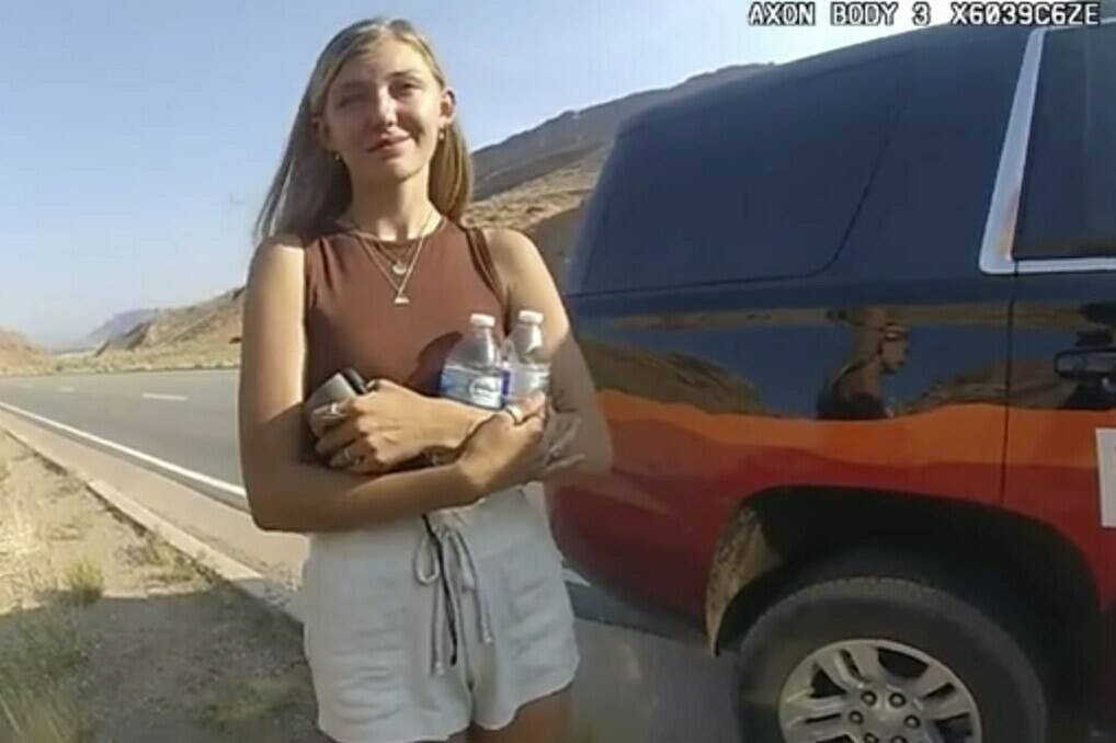 FILE - This police camera video provided by The Moab Police Department shows Gabrielle “Gabby” Petito talking to a police officer after police pulled over the van she was traveling in with her boyfriend, Brian Laundrie, near the entrance to Arches National Park on Aug. 12, 2021. (The Moab Police Department via AP)