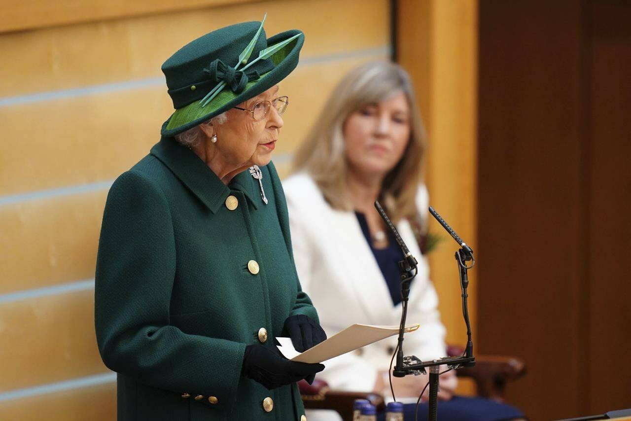 Britain’s Queen Elizabeth II delivers her speech in the debating chamber to mark the official start of the sixth session of the Scottish Parliament, in Edinburgh, Scotland, Saturday, Oct. 2, 2021. (Jane Barlow/Pool Photo via AP)