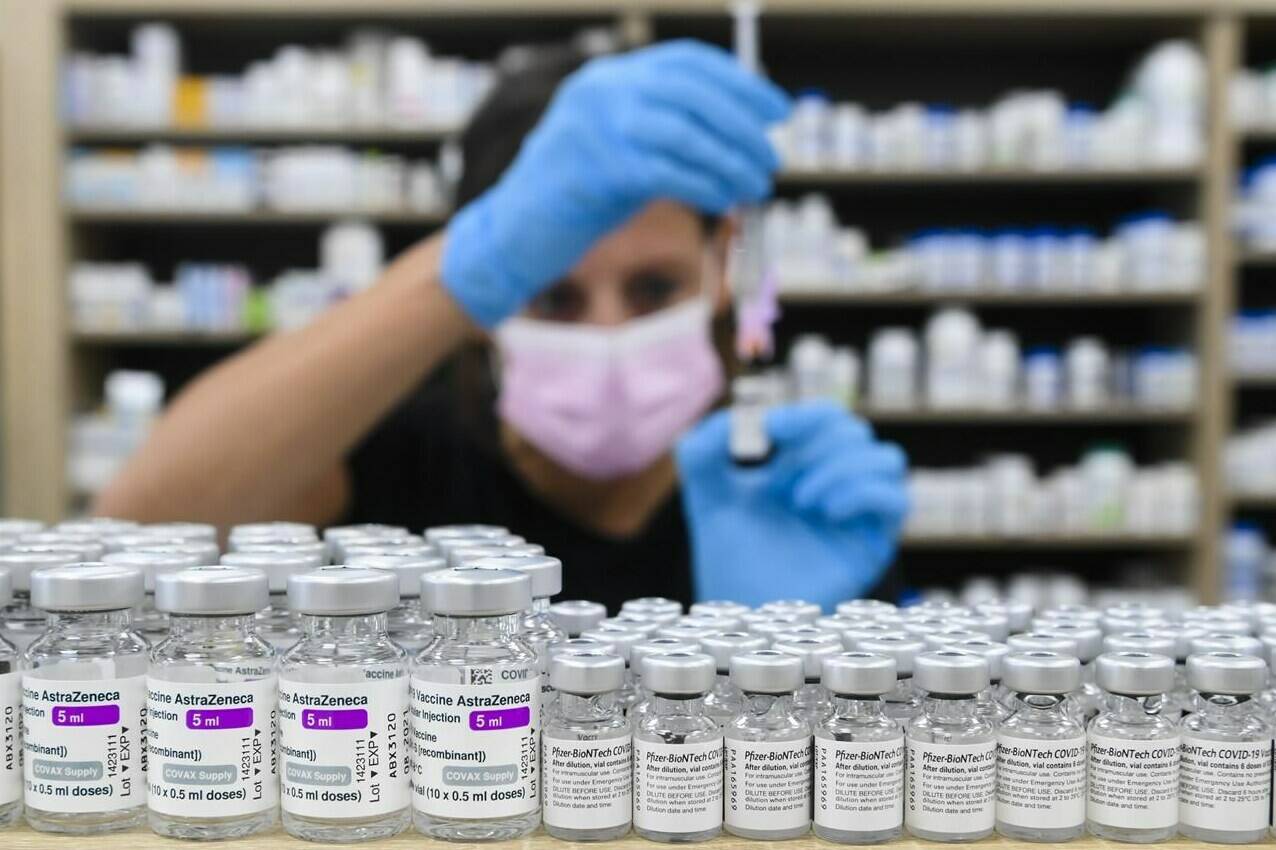 A pharmacist draws up a dose of COVID-19 vaccine in Toronto, Friday, June 18, 2021. THE CANADIAN PRESS/Nathan Denette