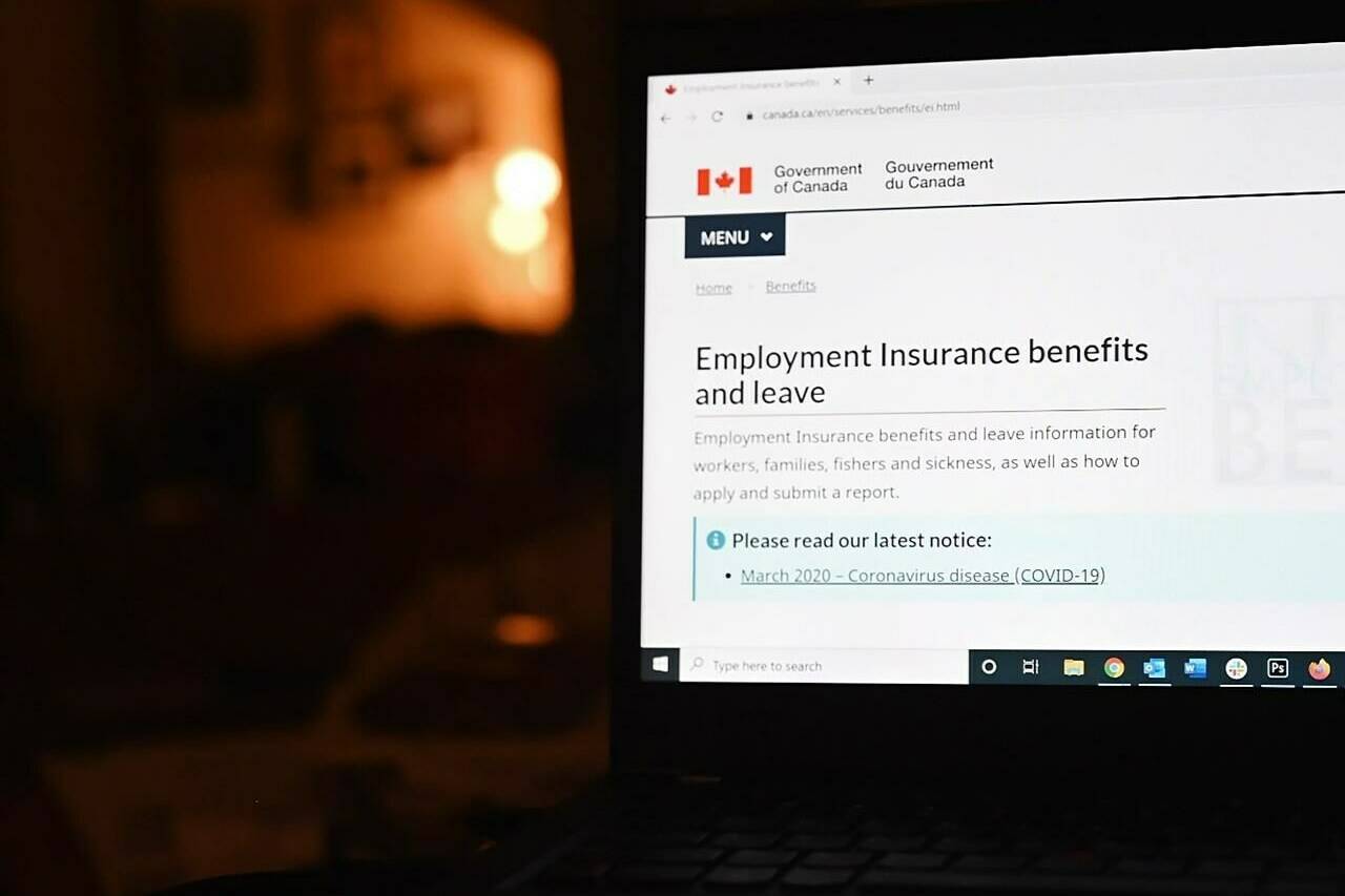 The employment insurance section of the Government of Canada website is shown on a laptop. THE CANADIAN PRESS/Jesse Johnston