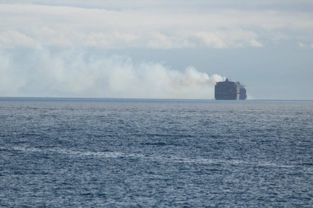 Smoke coming off MV Zim Kingston vessel can be seen from Victoria. (Jake Romphf/News Staff)