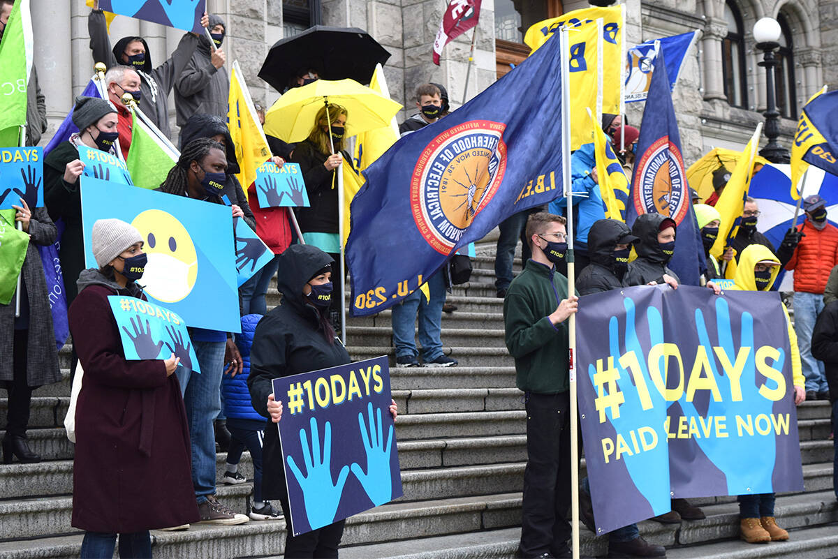 Demonstrators in favour of 10 paid sick leave days stand in front of the B.C. Legislature in Victoria on Oct. 25, the final day of the province’s consultation on the issue. (Kiernan Green/News Staff)