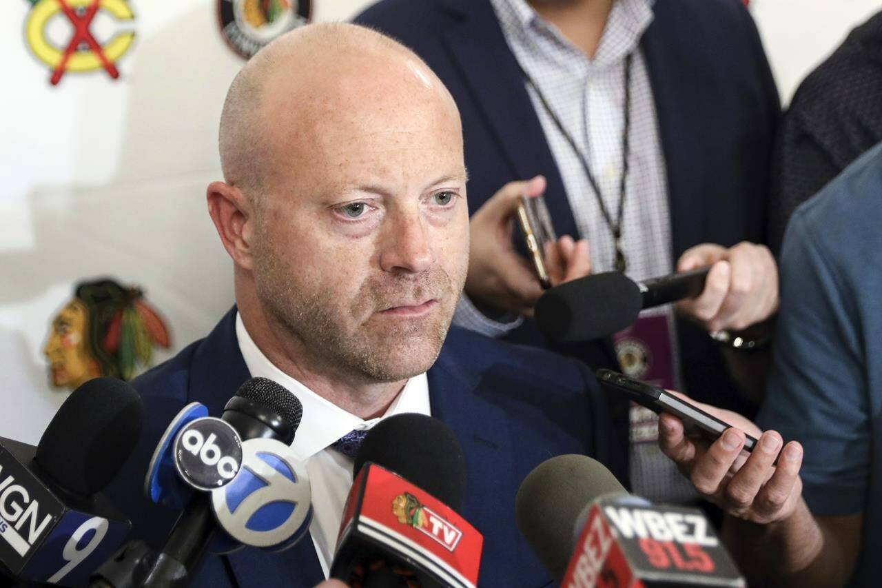 FILE- In this July 26, 2019, file photo, Chicago Blackhawks senior vice president and general manager Stan Bowman speaks to the media during the NHL hockey team’s convention in Chicago. Bowman resigned Tuesday, Oct. 26, 2021, following an investigation into allegations that an assistant coach sexually assaulted a player in 2010. (AP Photo/Amr Alfiky, File)