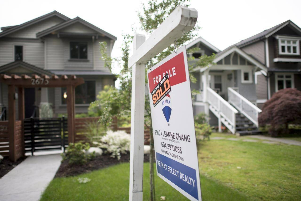 A real estate sign is pictured in Vancouver, B.C., on June 12, 2018. THE CANADIAN PRESS Jonathan Hayward