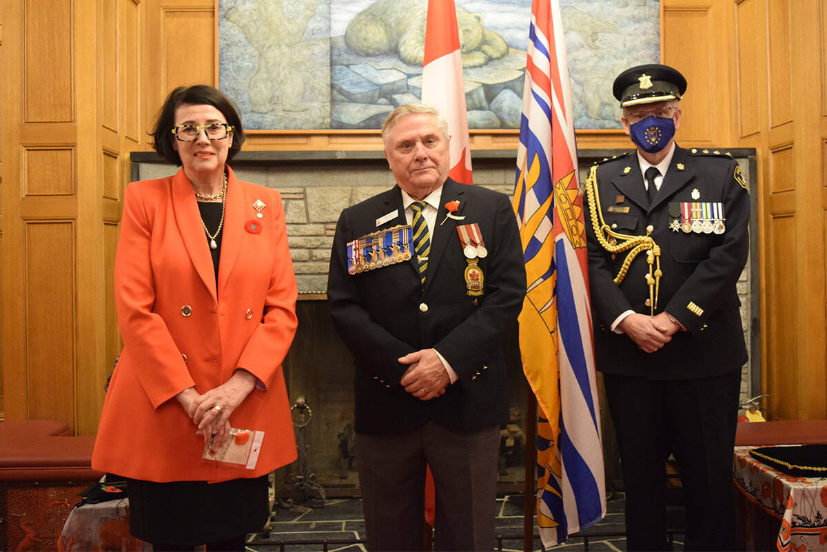 British Columbia Lt.-Gov. Janet Austin, Royal Canadian Legion BC and Yukon commander Angus Stanfield and Austin’s temporary aide-de-camp Glen Greenhill at Government House gather for the first poppy presentation, Oct. 26. (Kiernan Green/News Staff)