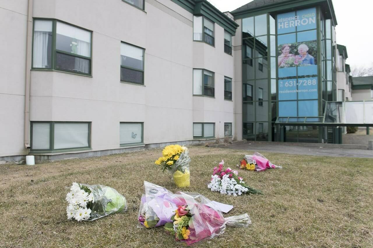 A Quebec coroner reminded an inquest into deaths at a privately-owned Montreal long-term care home that both the regional health authority and the care home’s management were responsible for the care of vulnerable patients. Flowers are shown outside Maison Herron, a long term care home in the Montreal suburb of Dorval on April 12, 2020. THE CANADIAN PRESS/Graham Hughes