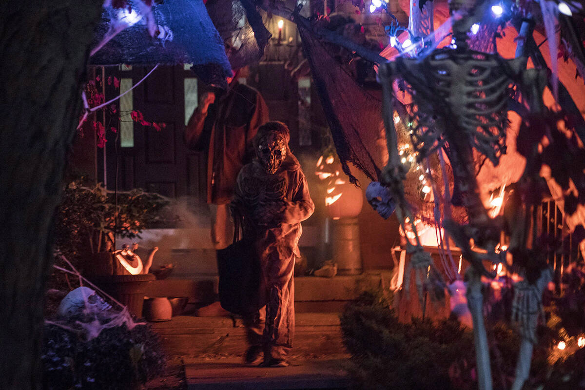 FILE – A costumed trick or treater turns after being given candy during Halloween celebrations in Toronto, on Tuesday, October 31, 2017. THE CANADIAN PRESS/Chris Young