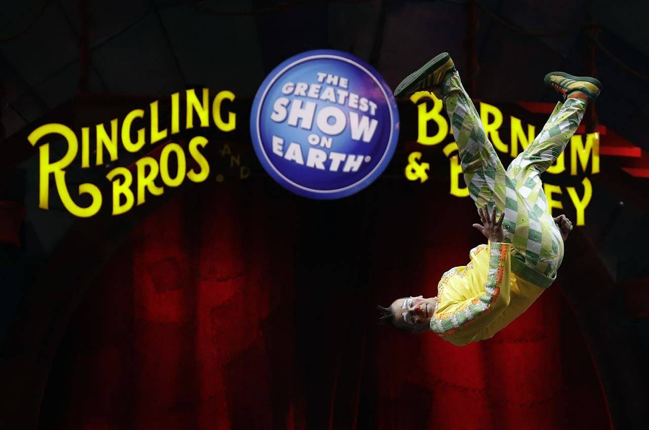 FILE - A Ringling Bros. and Barnum & Bailey clown does a somersault during a performance Saturday, Jan. 14, 2017, in Orlando, Fla. Four years after the “Greatest Show On Earth” shut down, officials are planning to bring back the The Ringling Bros. and Barnum & Bailey Circus. But animals will no longer be featured in their shows. A spokesperson for Florida-based Feld Entertainment says an announcement is expected sometime next year. The three-ring circus shut down in May 2017 after a 146-year run. (AP Photo/Chris O’Meara, file)