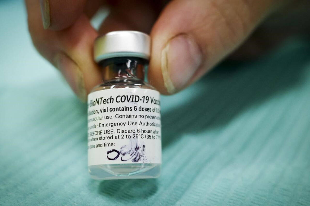 A vial of Pfizer-BioNTech COVID-19 vaccine is pictured at an Alberta Health Services vaccination clinic in Didsbury, Alta., Tuesday, June 29, 2021. The U.S. Food and Drug Administration has approved Pfizer-BioNTech’s COVID-19 vaccine for children aged five to 11, and Canada could be close behind. THE CANADIAN PRESS/Jeff McIntosh