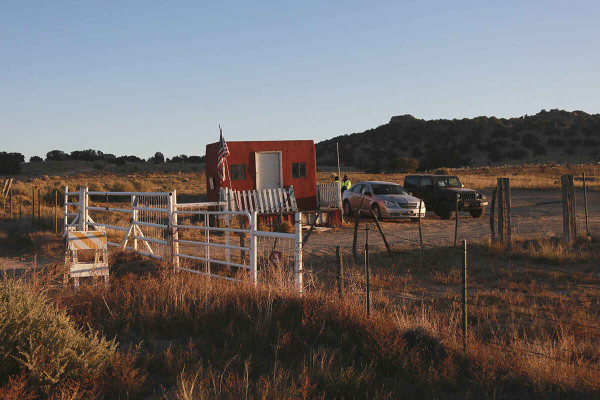The entrance to a film set where police say actor Alec Baldwin fired a prop gun, killing a cinematographer, is seen outside Santa Fe, New Mexico, Friday, Oct. 22, 2021. The Bonanza Creek Ranch film set has permanent structures for background used in Westerns, including “Rust,” the film Baldwin was working on when the prop gun discharged. (AP Photo/Cedar Attanasio)