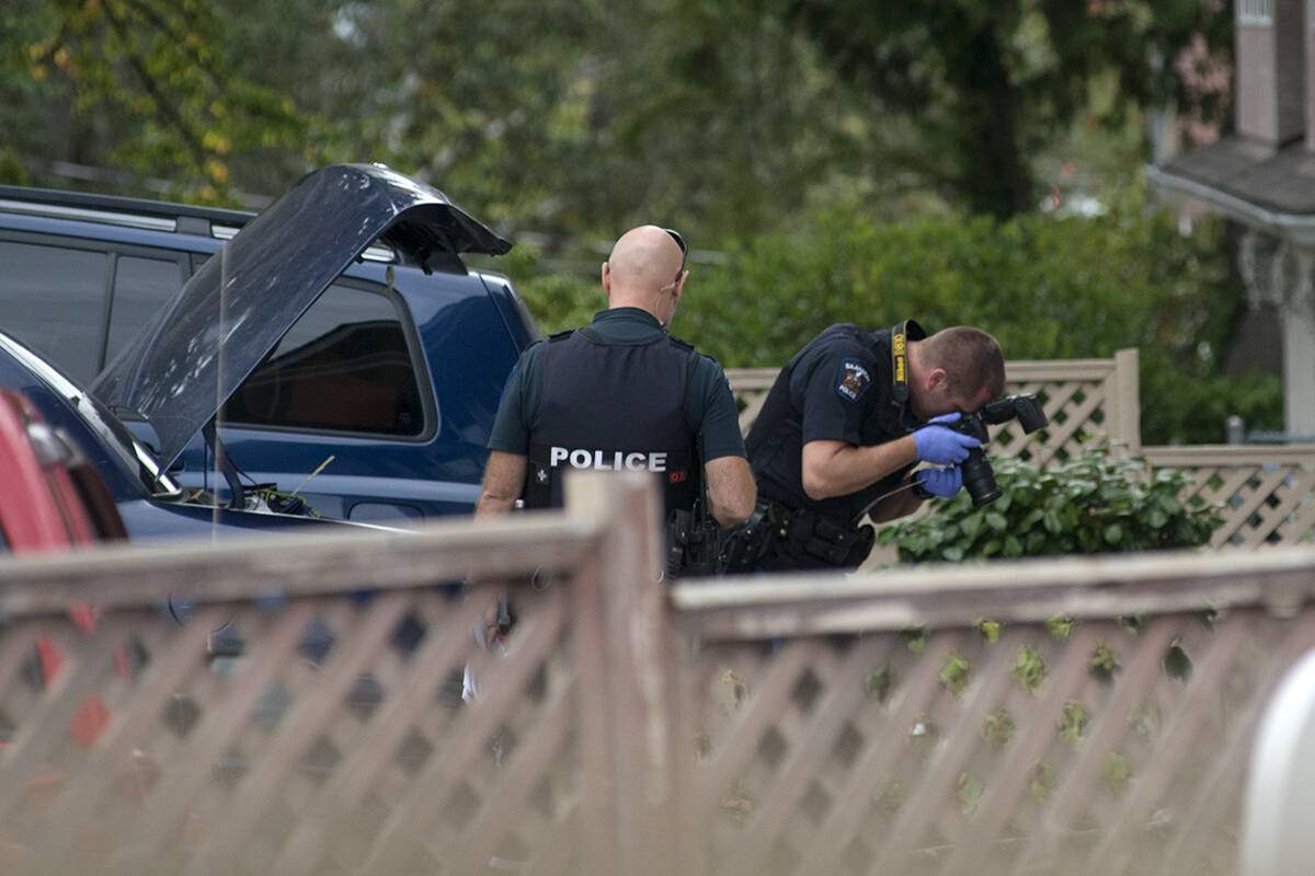 Saanich police work the crime scene in 2018 where Langford man Shawn Campbell was attacked; he later died in hospital. Two men convicted of manslaughter in the case were sentenced to six years each for the crime on Nov. 5. (Black Press Media file photo)