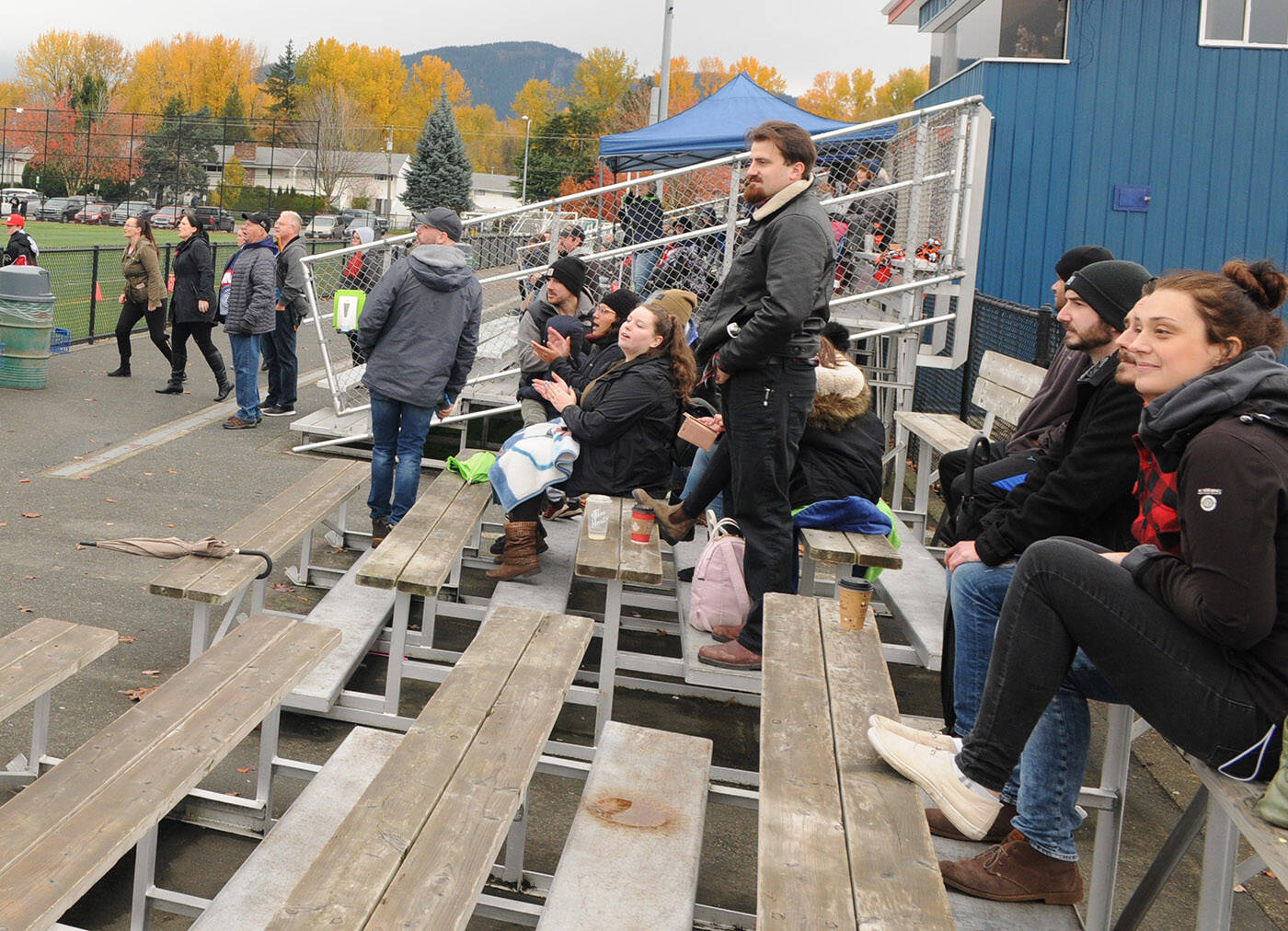 This small group of anti-vaxxers seated in the bleachers got their way past security and into a Chilliwack Giants football game at Townsend Park on Saturday, Nov. 6, 2021. (Jenna Hauck/ Chilliwack Progress)
