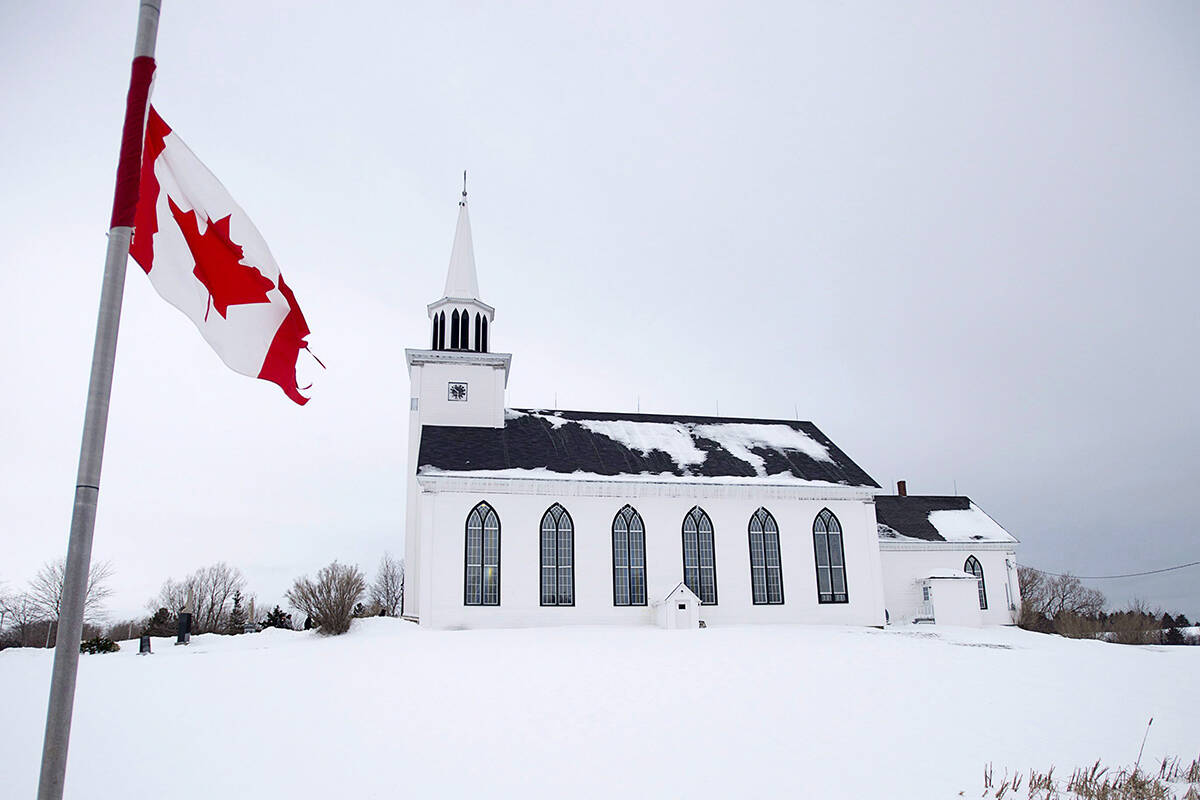 FILE – The Canadian flag flies at half-mast at the funeral for Lionel Desmond and his mother Brenda Desmond at St. Peter’s Church in Tracadie, N.S. on Wednesday, Jan. 11, 2017. Desmond killed his mother, wife and young daughter before taking his own life earlier in the month. THE CANADIAN PRESS/Andrew Vaughan