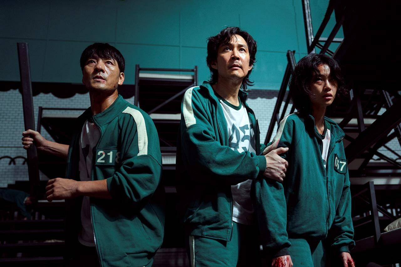 This undated photo released by Netflix shows South Korean cast members, from left, Park Hae-soo, Lee Jung-jae and Jung Ho-yeon in a scene from “Squid Game.” THE CANADIAN PRESS/AP-Youngkyu Park/Netflix via AP