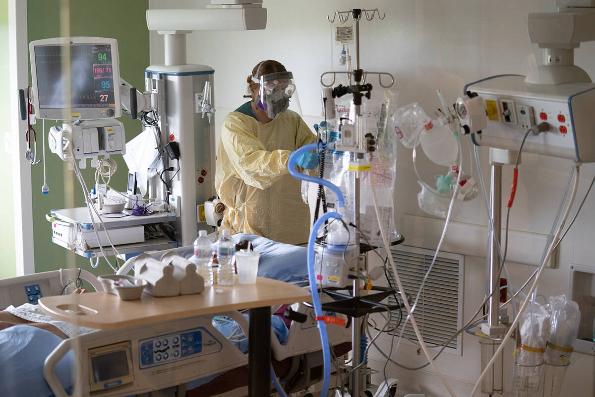 FILE – A nurse attends to a patient in the COVID-19 Intensive Care Unit at Surrey Memorial Hospital in Surrey, B.C., Friday, June 4, 2021. Most transplant patients will spend months in the ICU before receiving new lungs. THE CANADIAN PRESS/Jonathan Hayward