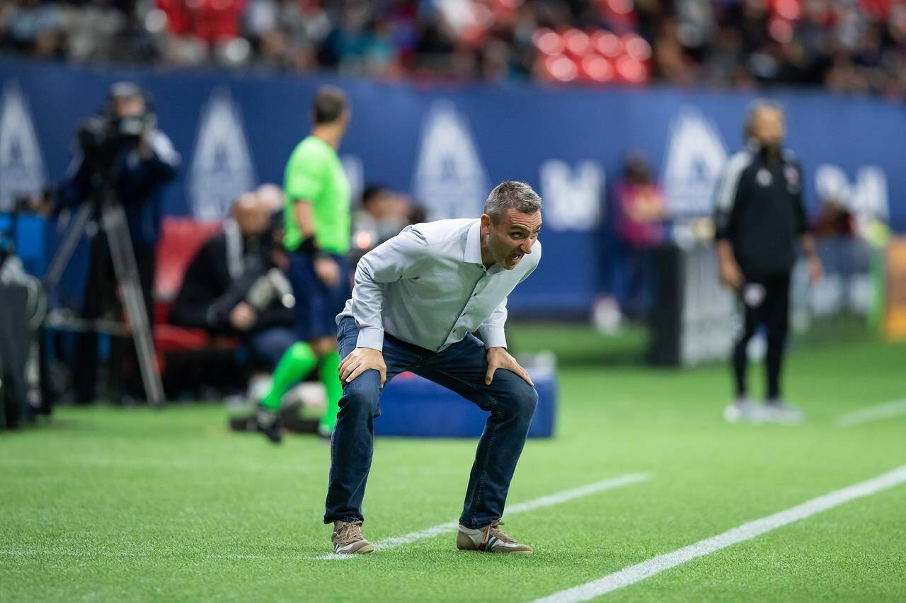 Vancouver Whitecaps acting head coach Vanni Sartini shouts on the sideline during the second half of an MLS soccer game against FC Dallas in Vancouver on Saturday, September 25, 2021. THE CANADIAN PRESS/Darryl Dyck
