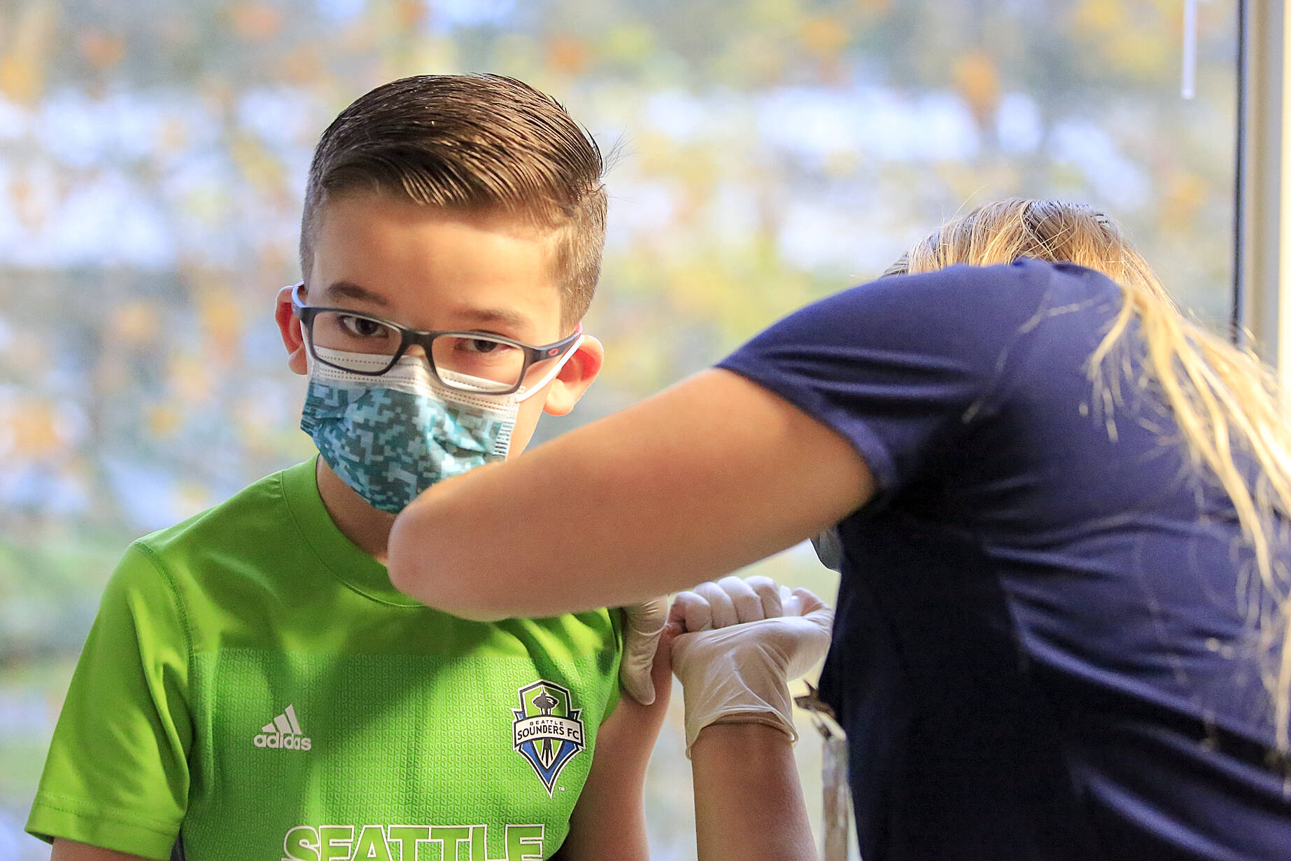 Kane Peterson, 9, gets a his COVID-19 vaccination Saturday morning in Everett, Washington on Nov. 6, 2021. Vaccination for children aged 5-11 are underway in the U.S. and a decision is pending from Health Canada. (Kevin Clark/Everett Herald)