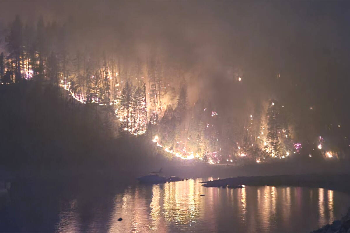 The Michaud Creek wildfire as it reaches the boundary of the Kutasewich property. Submitted photo