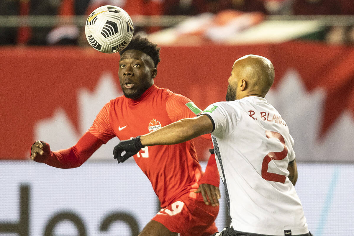 Team Canada’s Alphonso Davies (19) and Costa Rica’s Ricardo Jose Blanco Mora (2) vie for the ball during first half World Cup qualifier soccer action in Edmonton on Friday, November 12, 2021. THE CANADIAN PRESS/Jason Franson
