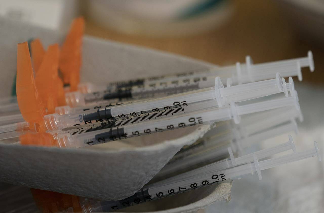 Needles are seen filled with the vaccination for COVID-19 at a truck stop along highway 91 North in Delta, B.C., Wednesday, June 16, 2021. THE CANADIAN PRESS/Jonathan Hayward