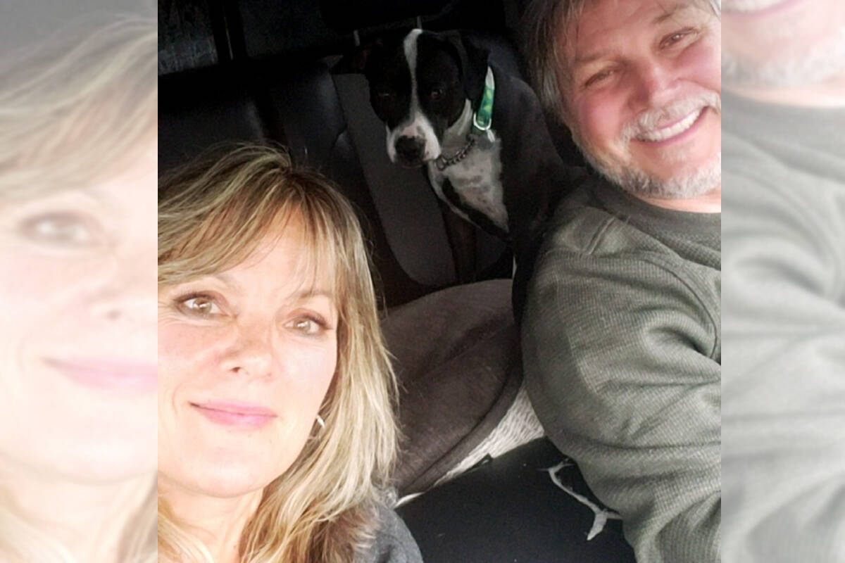 Tania and Scott with their dog, sitting inside a fogged-up car, waiting for help to arrive. (Tania Honeysett/Special to The News)