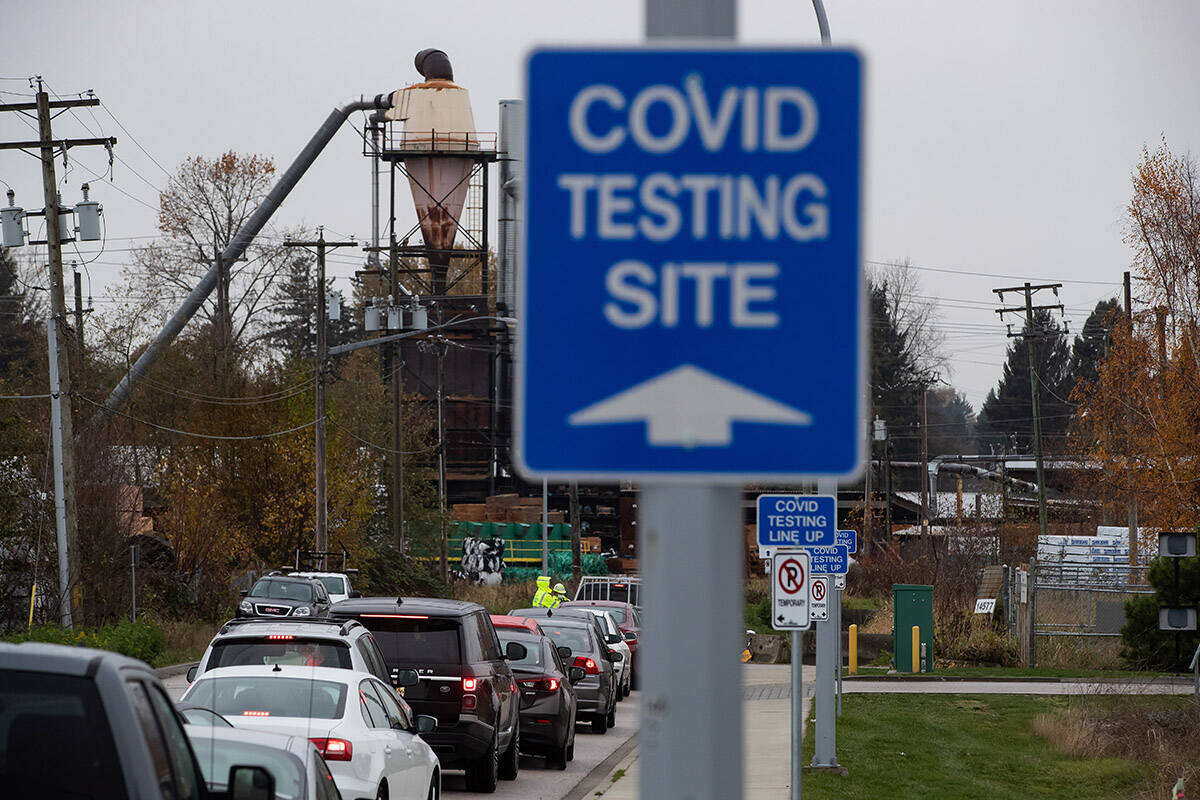 Motorists wait to enter a Fraser Health COVID-19 testing facility, in Surrey, B.C., on Monday, November 9, 2020. THE CANADIAN PRESS/Darryl Dyck