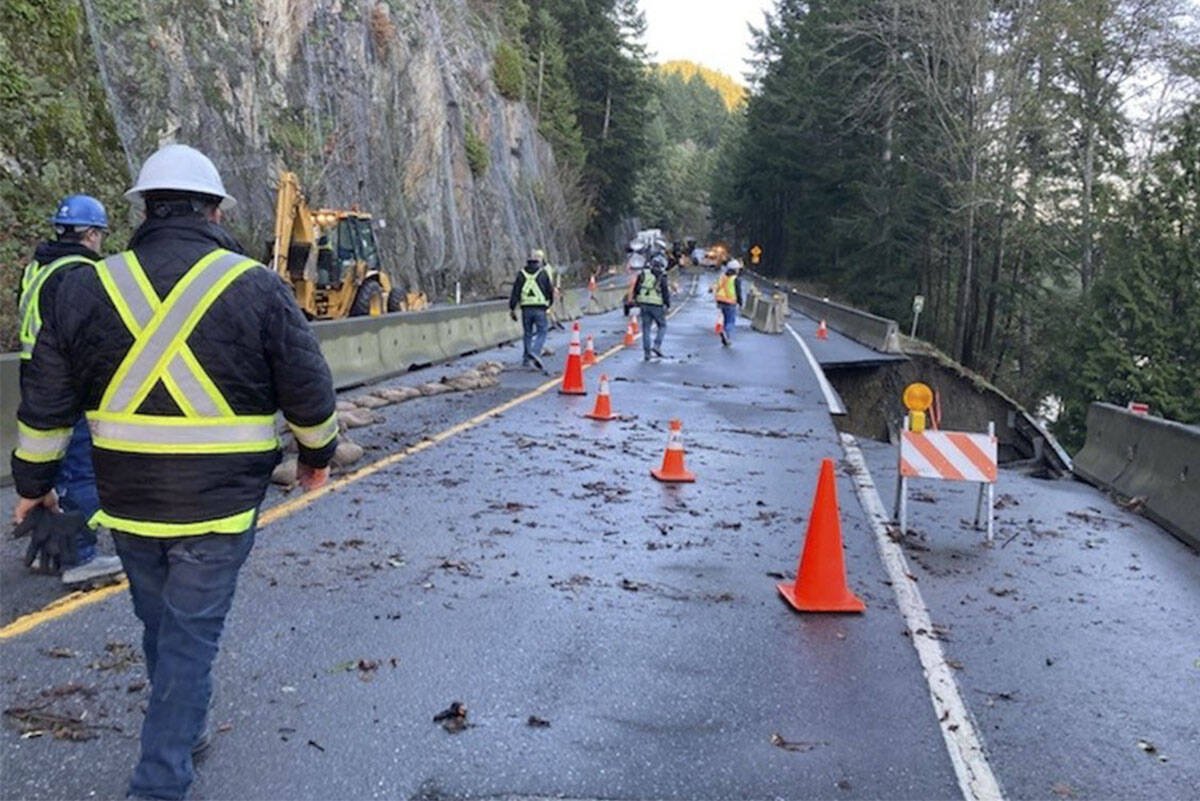 Vancouver Island emergency road crews begin work on a flood-damaged single-lane section of the Malahat Drive section of Highway 1. (Photo courtesy BC Transportation)