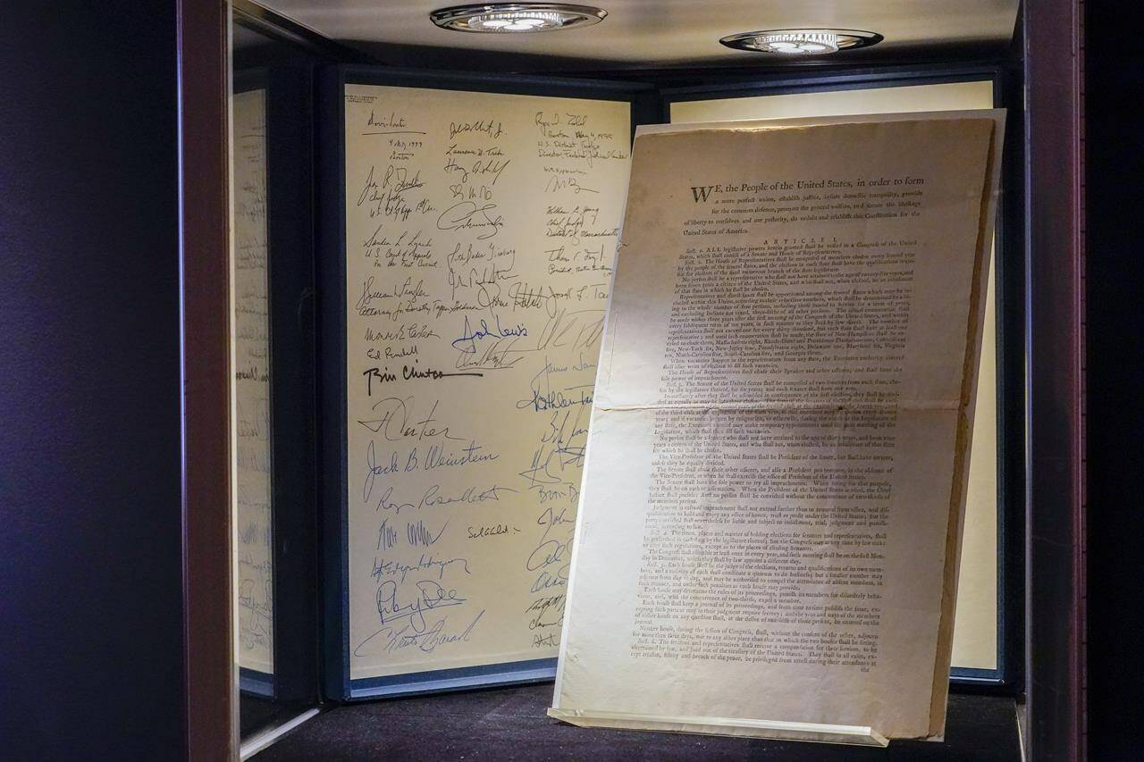 A first printing of the United States Constitution is displayed at Sotheby’s auction house during a press preview on Nov. 5, 2021, in New York. The rare copy has sold Thursday, Nov. 18, for a record $43.2 million at Sotheby’s to an anonymous buyer who outbid a group of crypocurrency investors. (AP Photo/Mary Altaffer, File)