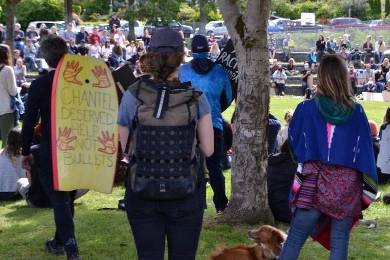 ‘Chantel deserved help not bullets’ reads the back of a demonstrators boogie board during a Tofino anti-racism rally last summer. (Westerly file photo)