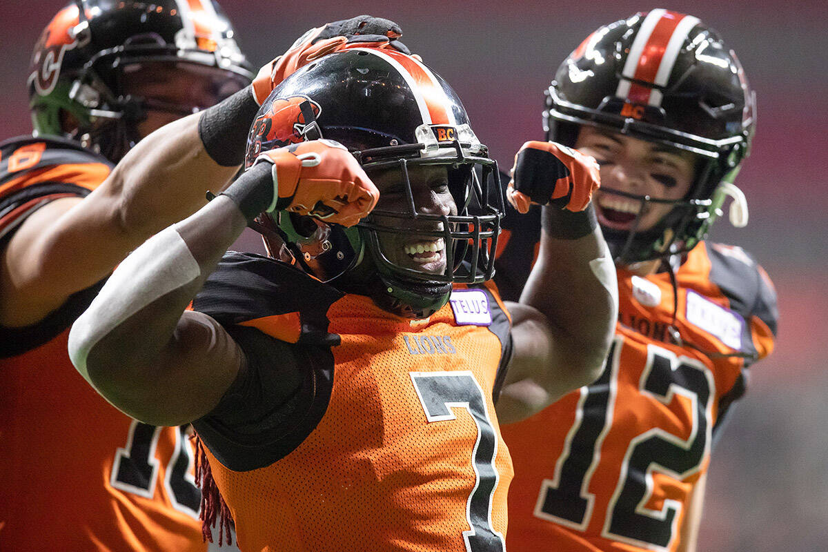 B.C. Lions’ Lucky Whitehead (7), quarterback Nathan Rourke (12) and Bryan Burnham, back left, celebrate before Whitehead’s touchdown was called back when he was ruled down at the one yard line during the first half of a CFL football game against the Edmonton Elks in Vancouver, on Friday, November 19, 2021. THE CANADIAN PRESS/Darryl Dyck