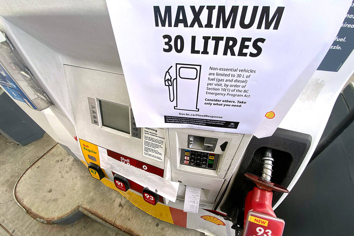 A sign noting a limit of 30 litres of gas for non-essential vehicles is shown at a gas station in Maple Ridge, B.C., on Sunday, Nov. 21, 2021. THE CANADIAN PRESS/Jonathan Hayward