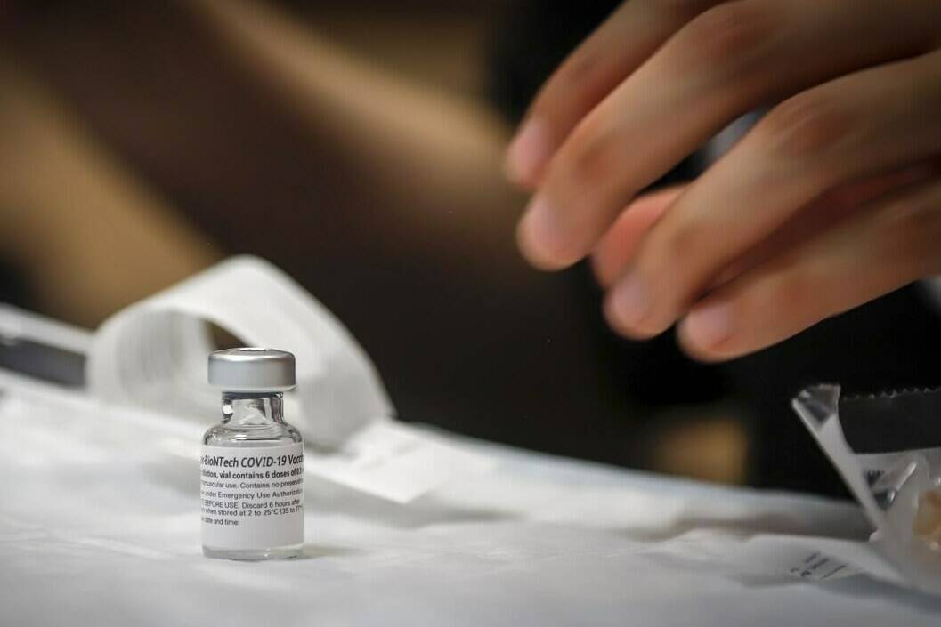 Nurse Iciar Bercian prepares a shot at a vaccine clinic in Calgary on June 2, 2021. THE CANADIAN PRESS/Jeff McIntosh