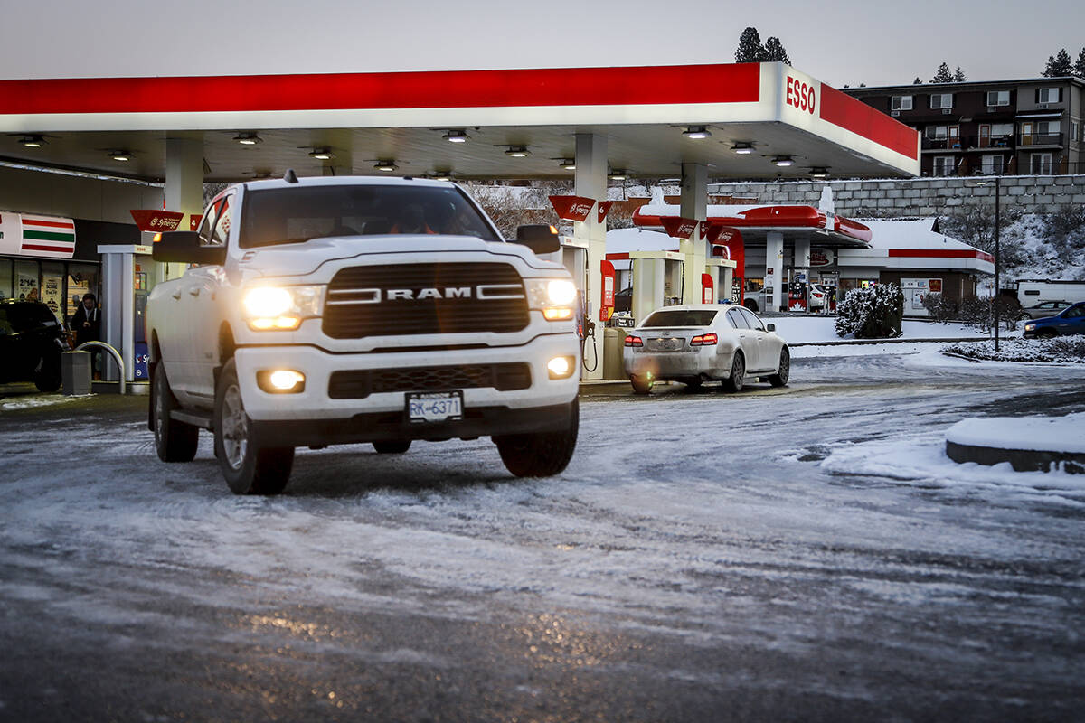 Motorists purchase fuel at a gas station in Kamloops, B.C., Friday, Nov. 19, 2021. British Columbia is rationing gas and prohibiting non-essential travel as fuel supplies are choked following recent devastating floods.THE CANADIAN PRESS/Jeff McIntosh