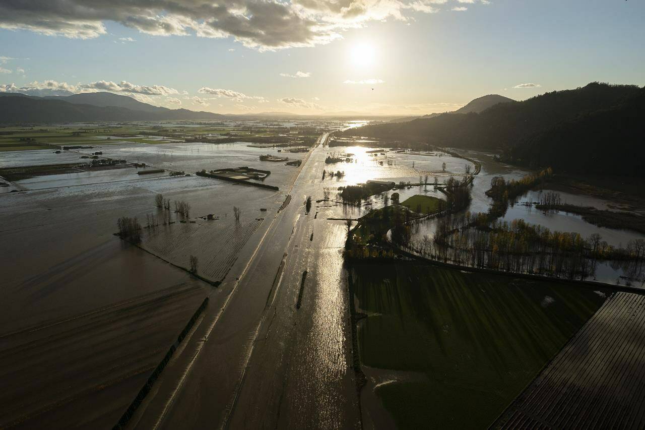 Flood waters cover highway 1 in Abbotsford, B.C., Tuesday, Nov. 16, 2021. THE CANADIAN PRESS/Jonathan Hayward